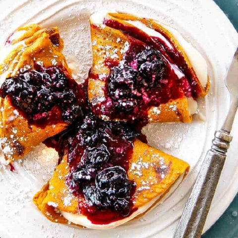 Carrot Cake Crepes with Cream Cheese and Blueberry Sauce